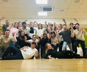 Amazon employees in a fun corporate dance class, engaging in a dynamic corporate dance workshop that boosts team spirit and wellbeing.