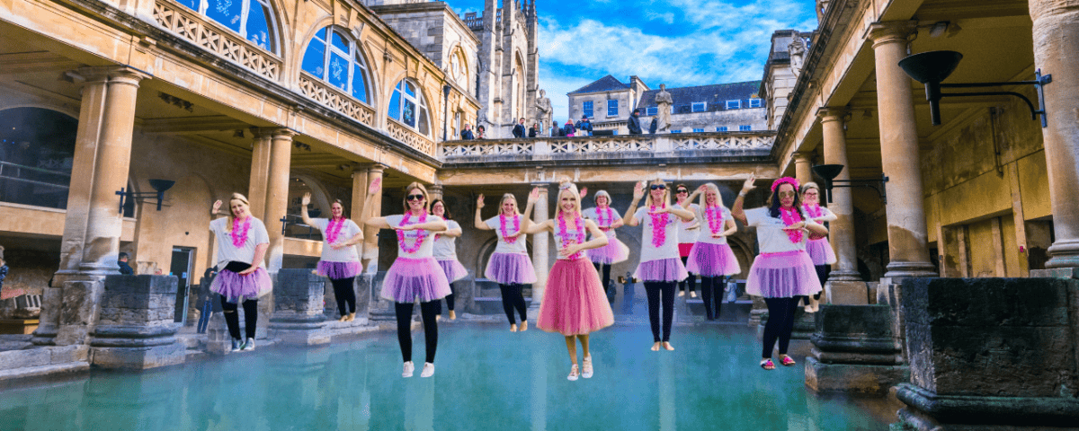 A lively group of hens enjoying a fun dance class in Bath, celebrating with energy and laughter during a hen party dance class. The scene captures the excitement and joy of a hen party dance class in Bath, offering a memorable experience for bridesmaids and guests. Perfect for those looking for dance hen parties in Bath or dance classes for hen parties in Bath.