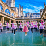 A lively group of hens enjoying a fun dance class in Bath, celebrating with energy and laughter during a hen party dance class. The scene captures the excitement and joy of a hen party dance class in Bath, offering a memorable experience for bridesmaids and guests. Perfect for those looking for dance hen parties in Bath or dance classes for hen parties in Bath.