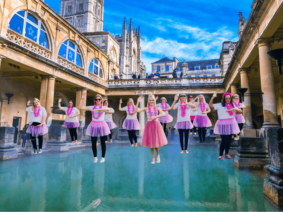 A lively group of hens enjoying a fun dance class in Bath, celebrating with energy and laughter during a hen party dance class. The scene captures the excitement and joy of a hen party dance class in Bath, offering a memorable experience for bridesmaids and guests. Perfect for those looking for dance hen parties in Bath or dance classes for hen parties in Bath.