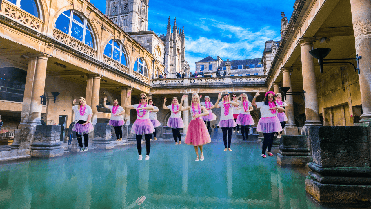 Group of women enjoying a lively hen party dance class in Bath, laughing and dancing together during a fun-filled hen do dance class. Perfect for dance hen parties in Bath.