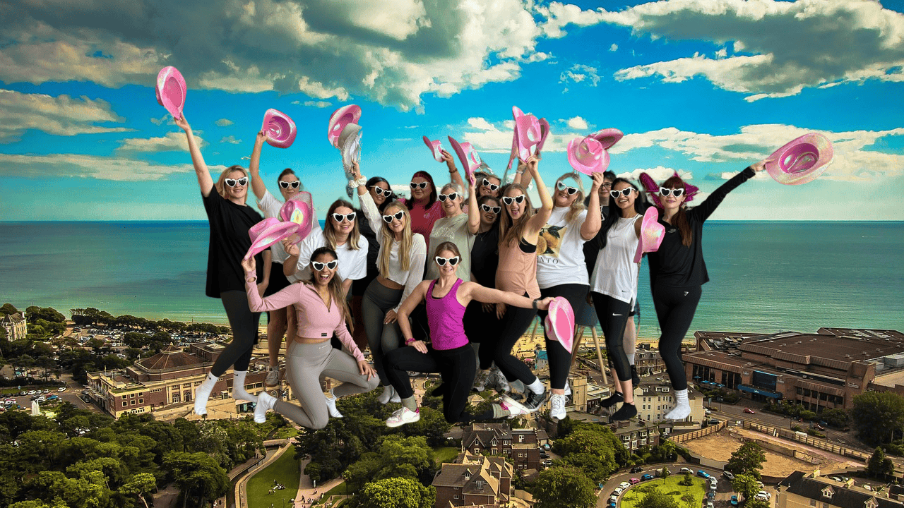 A group of happy hens enjoying a hen party dance class Bournemouth, laughing and dancing together. Perfect for dance hen parties Bournemouth, this fun-filled experience brings the bride tribe together with Bournemouth hen party dance classes tailored for all skill levels.