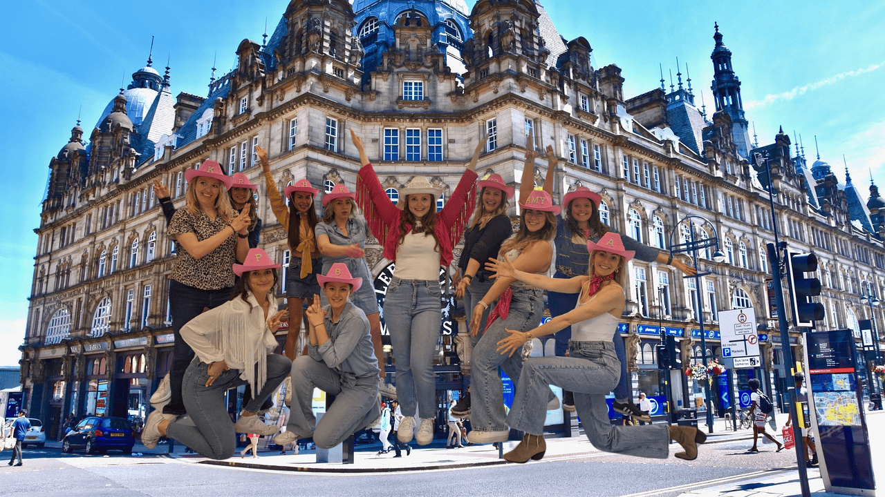 A joyful group of hens enjoying a hen party dance class in Leeds, laughing and dancing together. Perfect for dance hen parties Leeds, this fun-filled experience creates unforgettable memories with Leeds hen party dance classes tailored for all skill levels.