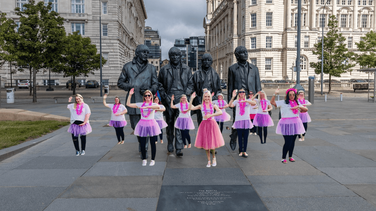 A group of hens having fun at a hen party dance class Liverpool, learning energetic moves in a lively atmosphere. The perfect way to celebrate a Liverpool hen do dance class with laughter, music, and unforgettable memories.