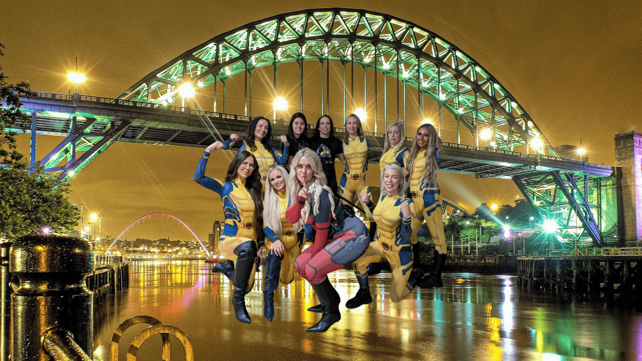 A group of hens laughing and dancing at a hen party dance class in Newcastle, celebrating with fun routines and unforgettable memories – the perfect Newcastle hen do dance experience!