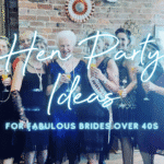 Hen party ideas for over 40s: elegant hen group laughing over prosecco