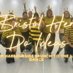 Hen do ideas Bristol: hen group celebrating at a dance class by the harbourside