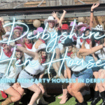 Hen party houses Derbyshire: hen group striking a pose outside a Peak District house with hot tub