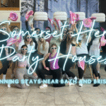Hen party houses Somerset: hen group having a fun themed dance class at their hen do house in Bath