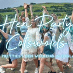 Hen party Cotswolds: hen group celebrating outside a honey-stone hen house