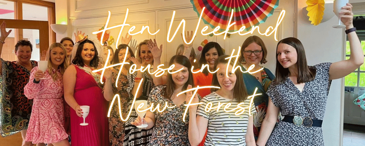 Hen weekend house in the New Forest: hen group in the lounge of a country cottage celebrating with a glass for fizz.