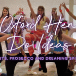 Oxford hen do ideas: hen group celebrating with the dreaming spires behind them